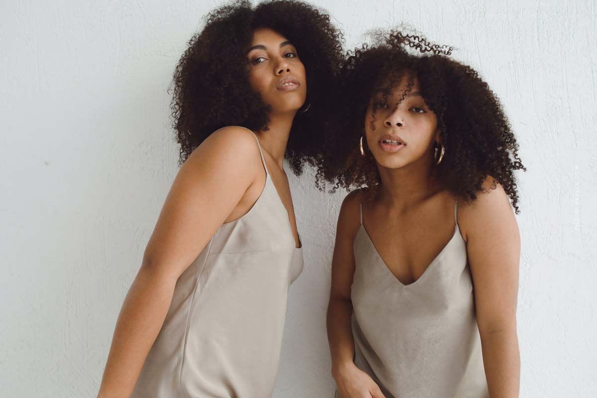 model-agency-management-young-models-curly-hair-grey-dress-sisters